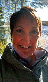 Rev Kristi Borst PhD by the lake in southern Maine
